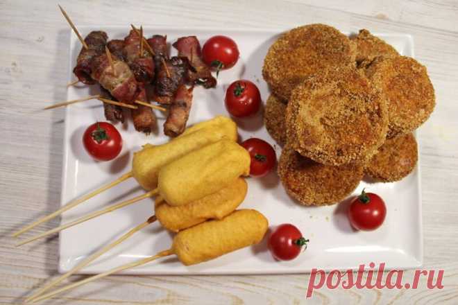 3 вкусных закуски для большой компании. Корн доги, финики в беконе, луковые кольца Сегодня приготовим 3 рецепта закусок, которые отлично подойдут для домашних посиделок с друзьями: корн доги, финики в беконе, луковые кольца. Закуски, бекон, видео рецепт, еда, корн дог, луковые кольца за 20.02.2019 от Edaprosta на Fishki.net
