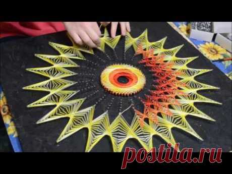 Процесc создания картины в технике string art.