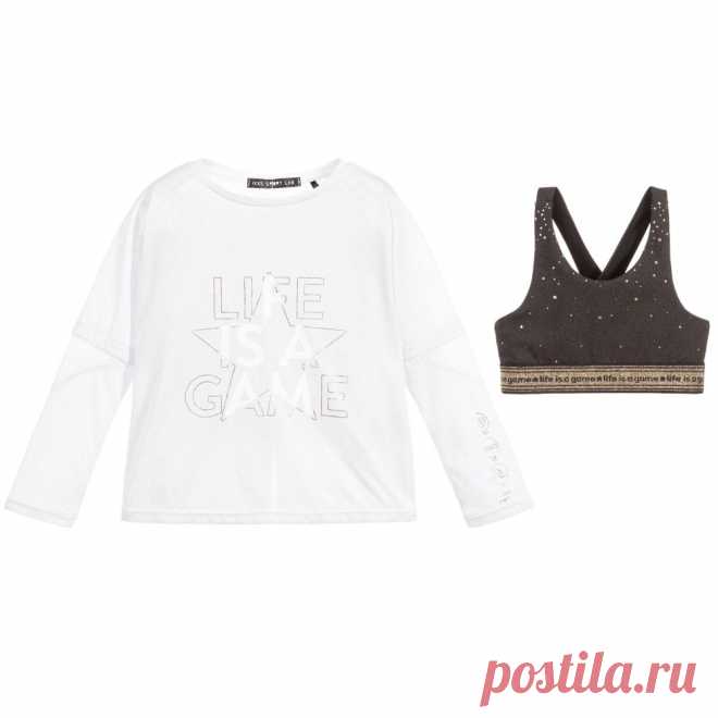 White Sports Top & Bra Set Girls two-piece white sports top and cropped bra set by IKKS. The white jersey top has mesh trims with a gold and white slogan print on the front. The dark grey cropped top is printed with gold stars and has a sparkly gold, elasticated band woven with 'life is a game'.

