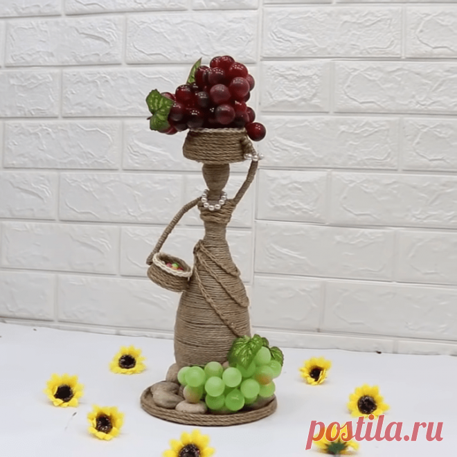 Интерьерная статуэтка из обычного джута Не лишенная очарования изящная интерьерная статуэтка станет отличным украшением, наполняющим дом особым теплом и уютом. Взглянув на грациозную сборщицу винограда, сложно догадаться, что она собрана бу...