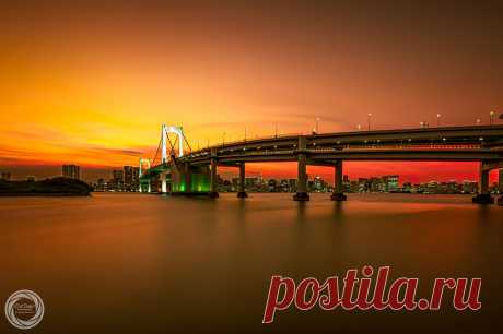 Golden Glow, Tokyo Rainbow Bridge Colors of evening glow caputerd with 3 minutes exposure, Tokyo Rainbow Bridge in lit and the cityscape of Tokyo Bay area. Taken in "Daiba Park", Minato-Ward, Tokyo, Japan. Pentax K-3, Sigma 10-20mm F4-5.6 EX DC / HSM. On July, 11, 2017, 19:05.  Focal 10mm / Aperture f11 / ISO100 / Exposure 180s. RAW deveppment (16bit TIFF) in Adobe Photoshop Lightroom CC 2015.10.1 and Color Efex Pro 4 with Adobe Photoshop CC 2017.1.1.  ©45tmr 2017, All Rig...