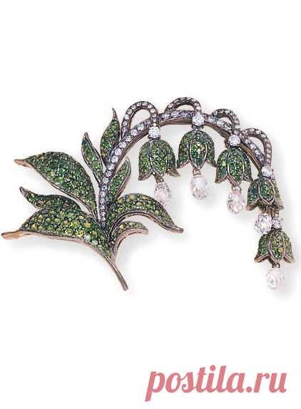 A TSAVORITE AND DIAMOND FLORAL BROOCH Designed as a series of tsavorite lilies, each suspending a briolette-cut diamond, to the circular-cut diamond stems and tsavorite leaves