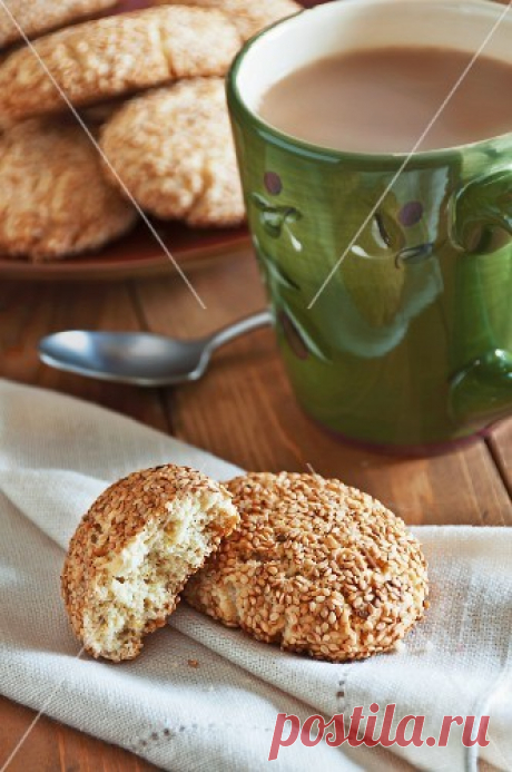 Regina Sesame Cookies on a Linen Napkin with a Cup of Coffee – StockFood