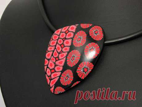 Statement necklace in black and red, unique polymer clay, millefleur, millefiori, fimo, art clay Handmade unique necklace in black and red colors. OOAK. A big fashionable statment, but lightweight and so elegant.   The pendant has hangs on a black rubber cord 17,7 inch (45 cm) or 50cm.  Material: polymer clay, rubber cord and metal clasp. See the other colors in my shop.  My beads are handmade by me and my unique design. The beads have been sanded through multiple grits of...