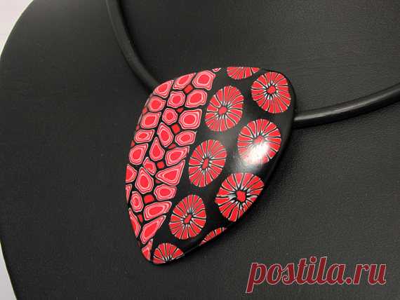 Statement necklace in black and red, unique polymer clay, millefleur, millefiori, fimo, art clay Handmade unique necklace in black and red colors. OOAK. A big fashionable statment, but lightweight and so elegant.   The pendant has hangs on a black rubber cord 17,7 inch (45 cm) or 50cm.  Material: polymer clay, rubber cord and metal clasp. See the other colors in my shop.  My beads are handmade by me and my unique design. The beads have been sanded through multiple grits of...