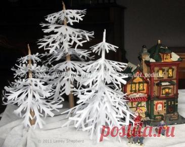 Зимние деревья из снежинок Зимние деревья из снежинокПросто нанижите снежинки на стержень.