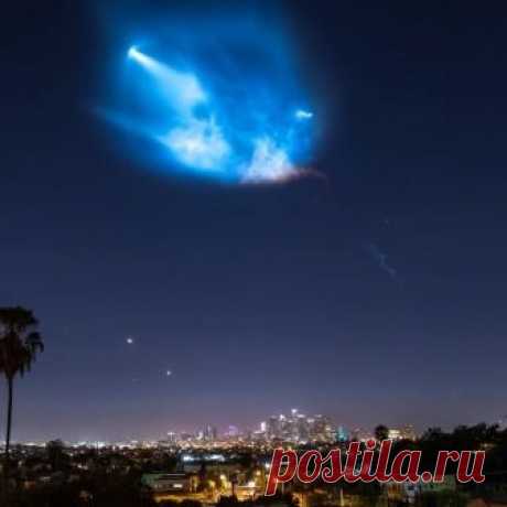 Falcon 9 taking off above downtown LA.  Shot at 1 second interval alongside