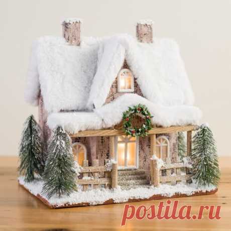 This charming Lighted Snowy Paper House will make a beautiful addition to anyone's snow-covered Christmas village.