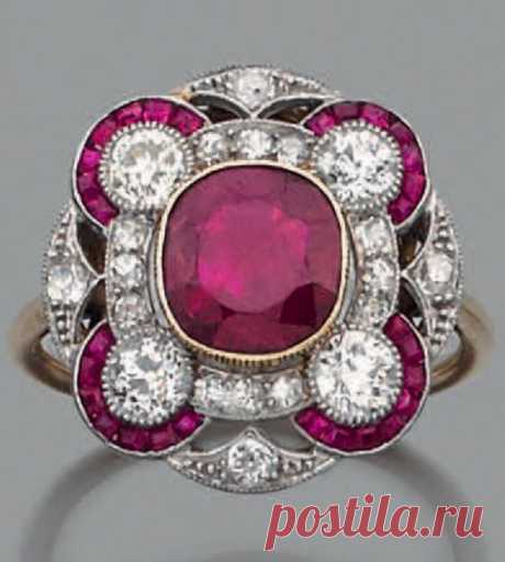 An Art Deco platinum, 18k gold, Burmese ruby and diamond ring.