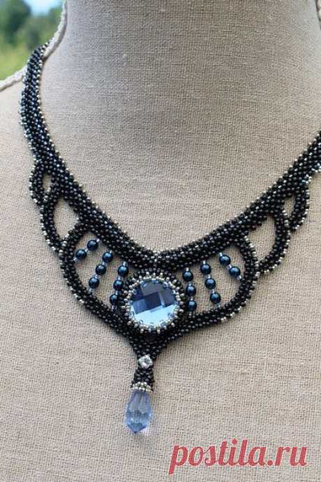 Beadwoven charcoal necklace with light blue chessboard cabochon and firepolished drop bead. | ideas: jewelry