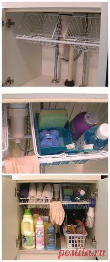 Easy Tips to Organize your Kitchen - Use small tension rods to hold wire baskets at an angle under the kitchen sink - Would work great in the bathroom too - so cheap and so clever!