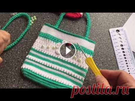 Во второй части видео урока мы закончим вязание детской сумочки, вывяжем ручки, применяя способ вязания шнур-гусеничка, вывяжем цветочек для отделки с...