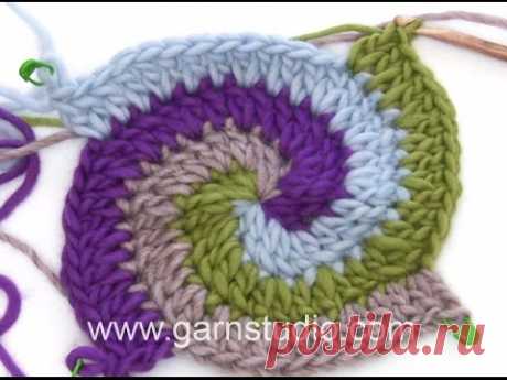 DROPS Crocheting Tutorial: How to work a Pot holder with stripes and spiral.