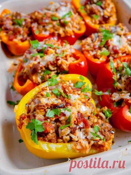 Hot Italian sausage stuffed peppers with fire roasted tomatoes, onion, garlic, flavorful rice, a ton of spices topped with delicious cheese & fresh parsley.