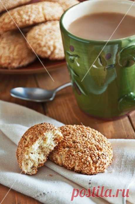 Regina Sesame Cookies on a Linen Napkin with a Cup of Coffee – StockFood