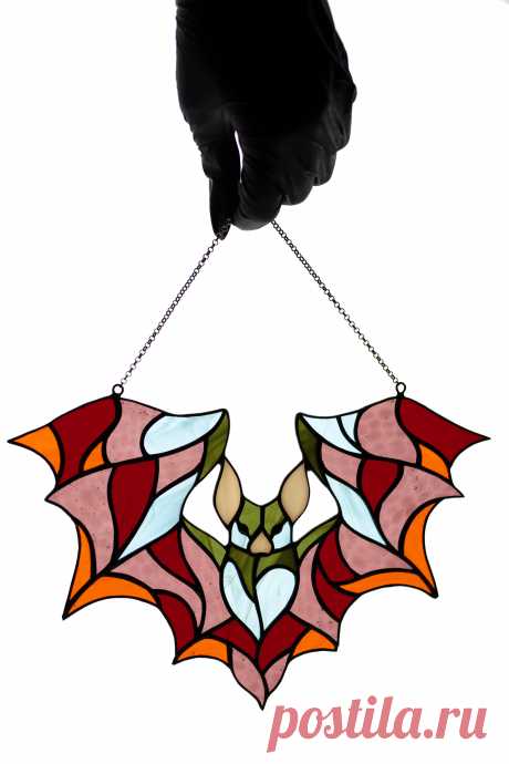 Stained glass suncatcher Bat window hanging Glass colorful bat Christm Window hanging suncatcher made of stained glass pieces by my own disign.Handmade using Tiffany copper foil technique.Looks amazing in the sunlight.You will get it completely ready for installation. It comes with a self-adhesive hook and copper chain.It will be a great gift for friends or relatives. Width: 10 inches Hei