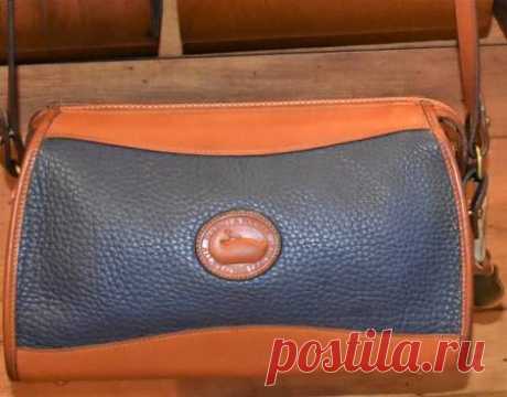 Dooney and Bourke All-Weather Leather   Timeless Design  Zipper Top Shoulder/Crossbody Bag/Clutch Purse Dooney and Bourke All-Weather Leather     
 Timeless Design      
Zipper Top    
Shoulder/Crossbody Bag/Clutch Purse   
   
 

Color: Airforce Blue    with British Tan   Trim     

This is a lovely rare Classic Zipper Top AWL Dooney  
 
7 by 3.5 by 11  
Adjustable & removable Leather Shoulder Strap with 18-22 strap drop length.  

Red, White, Blue Dooney and Bourke, Inc....