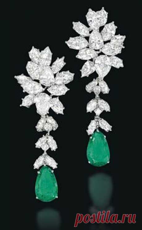 A PAIR OF EMERALD AND DIAMOND EAR PENDANTS Of foliate design, the pear-shaped emerald suspended from a detachable diamond line to the pear and marquise-cut diamond cluster surmount, 5.7cm long