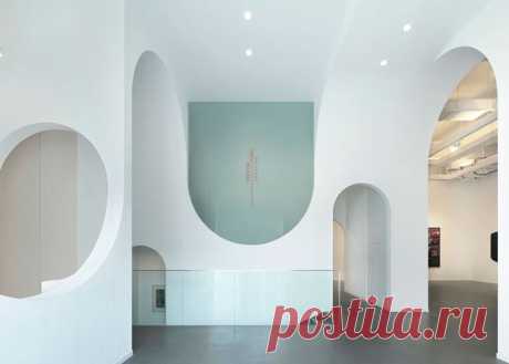 Beijing art gallery by Penda featuring topsy-turvy archways