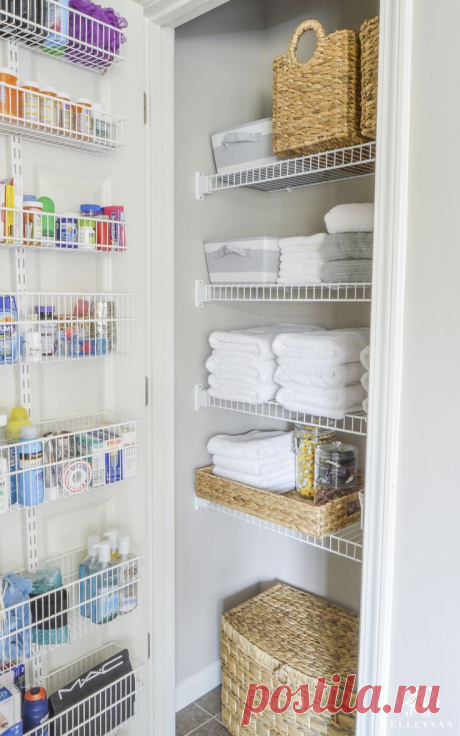 Organized Bathroom Linen Closet Anyone Can Have - Kelley Nan- Elfa door system with medicine storage solution