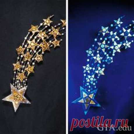 This comet design brooch of gold set with colorless and fancy colored diamonds showers sparks when exposed to UV light.