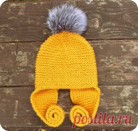 Long Earflap Hat with Faux Fur Pompom Knitting pattern by Bummbul