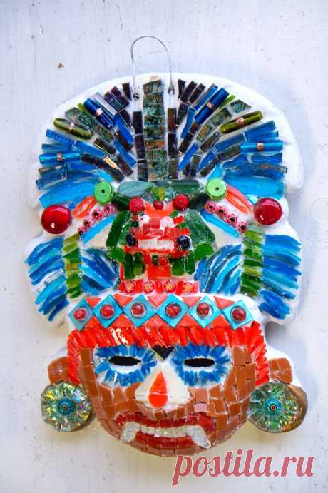 Weekend WIP's--Aztec Mask It's glued!  Feather headddress made from stained glass, vitreous glass tile, beads, marbles, millefiori, green turquoise beads.  Face made with stained glass, shell beads, beads, vitreous tile, millefiori.  The double bird headed frog part was the hardest.