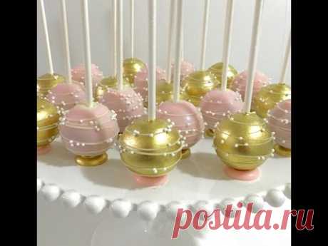 Upside down pink & gold Cakepops with flat bottom base and stripes/swirls design