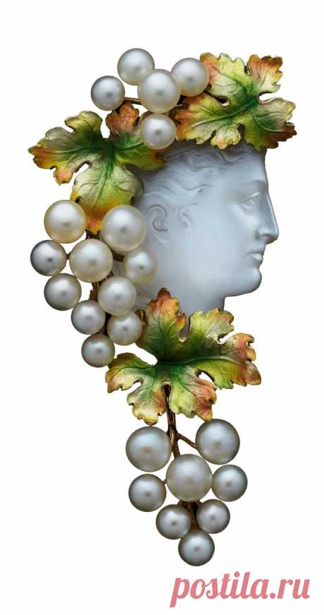 An Art Nouveau Bacchante Moonstone jewel, circa 1880, probably American. The carved cameo moonstone head of a Bacchante facing towards the right in profile, her wavy hair crowned with greenish…