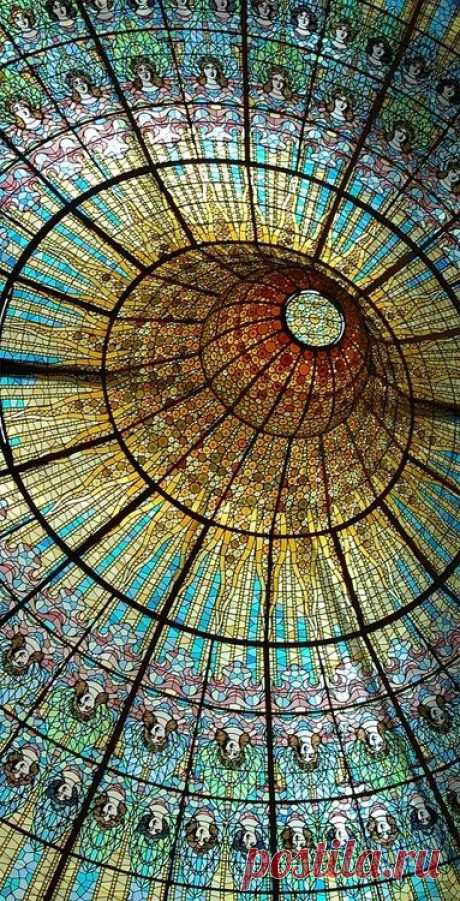 simobutterfly: Extremely intricate stained glass on ceiling of Palau de Catalan Music in Barcelona.