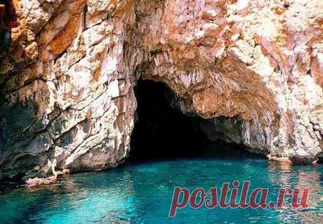 (2) This is Montenegro
Plava Spilja (Blue Grotto) – Blue Cave

Imagine if you found a small boat on the side of a tranquil bay and the captain, after helping you on board, set sail up the coast for what only seemed like a 10 minute trip. You’re headed towards Plava Spilja, and the excitement takes hold of you. You’re expectations are running high, although after your short trip the captain suddenly steers the boat directly at a cliff of rough rocks.