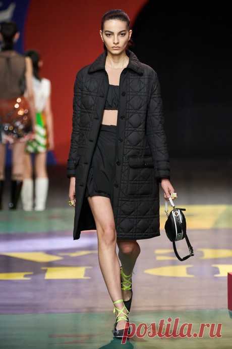 Image may contain Human Person Clothing Apparel Coat Runway and Fashion