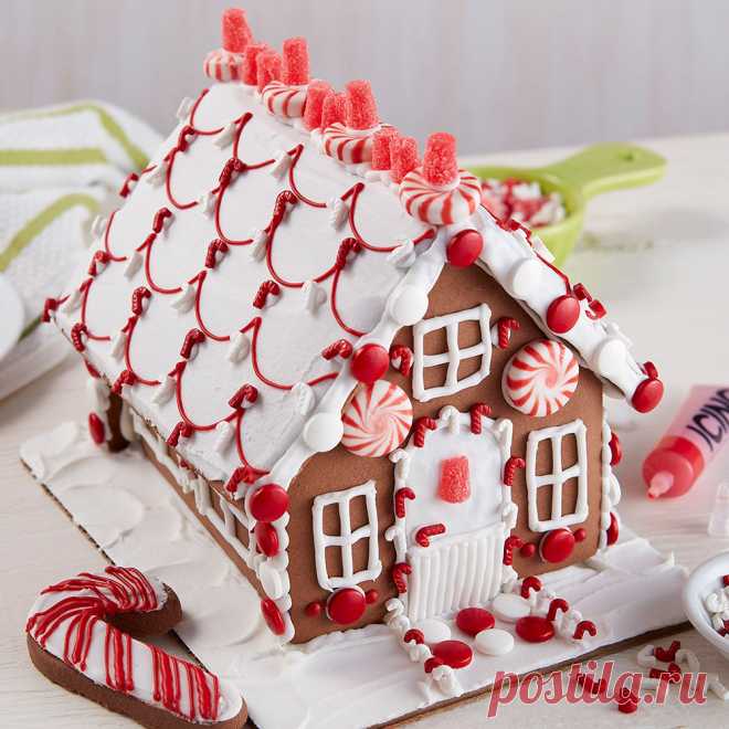 Designer Chocolate Cookie House #2 One look and you won’t be able to wait to decorate this chocolate cookie house, bright with visions of peppermint colors and candy.  Sharing the activity of decorating this house together makes the entire family merry!